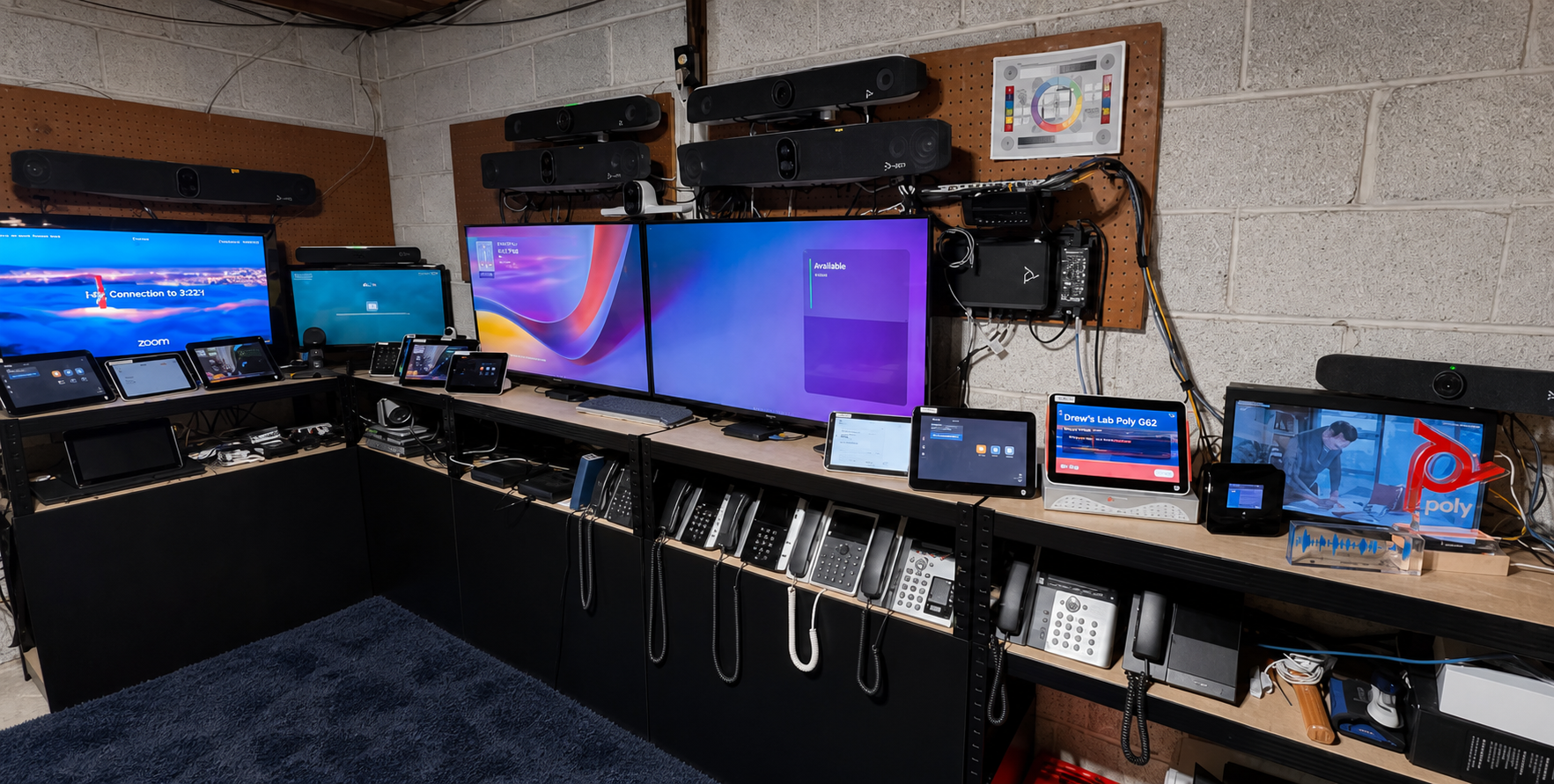 Unified Collaboration and Interoperability Lab with collaboration displays, cameras, control interfaces, phones, and endpoint systems